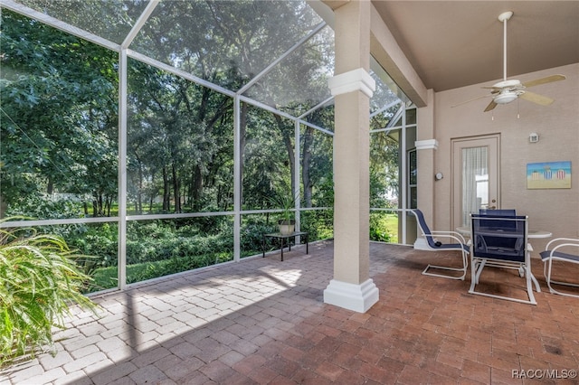 view of patio / terrace with glass enclosure and ceiling fan