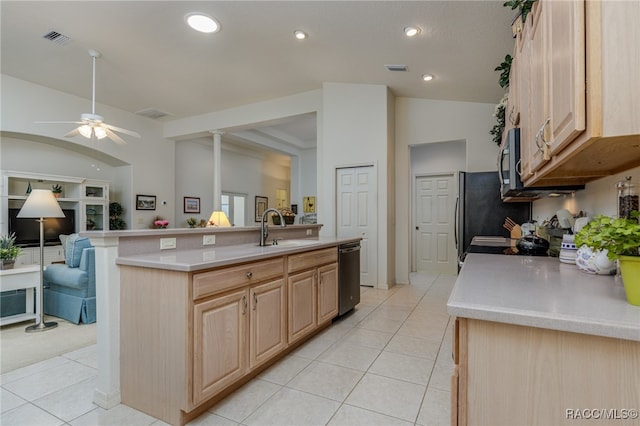 kitchen featuring light brown cabinets, sink, lofted ceiling, and stainless steel appliances