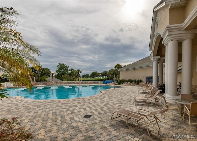 view of swimming pool with a patio area