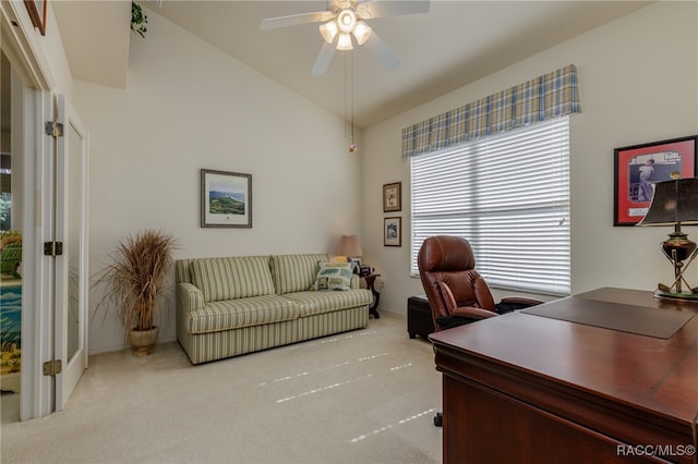 office space with ceiling fan, light carpet, and high vaulted ceiling