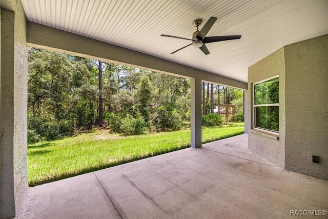 5352 W Corral Pl NW, Beverly Hills, FL 34465 - view of patio featuring ceiling fan and view of wooded area