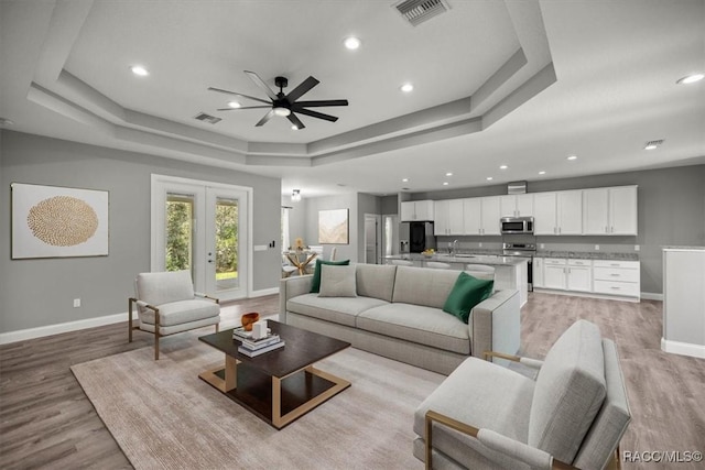 5352 W Corral Pl NW, Beverly Hills, FL 34465 - living area with a raised ceiling, ceiling fan, light wood-type flooring, recessed lighting, and french doors