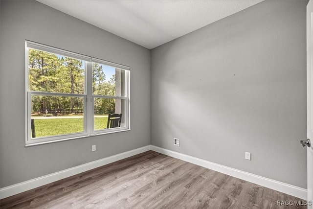 5352 W Corral Pl NW, Beverly Hills, FL 34465 - spare room featuring wood finished floors and baseboards