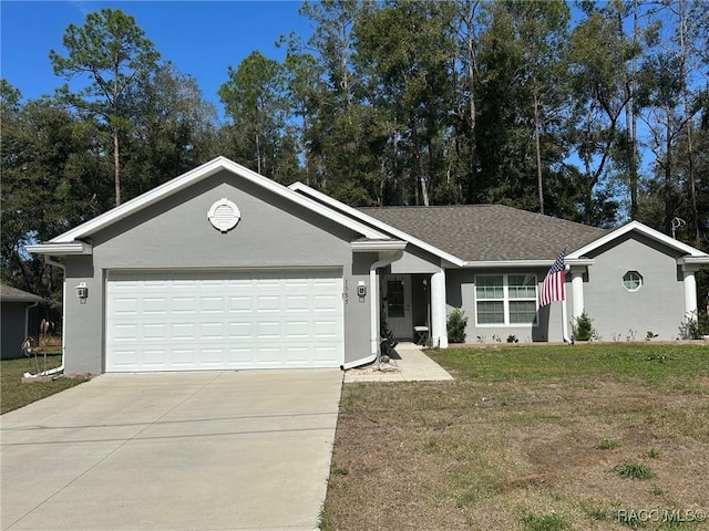 ranch-style house featuring a garage and a front lawn