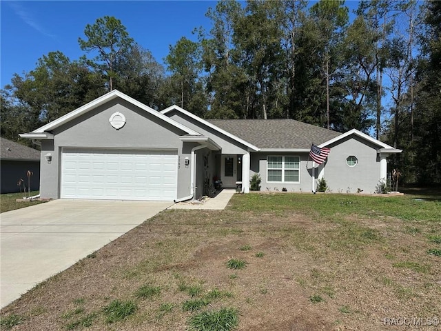 single story home featuring a garage and a front yard