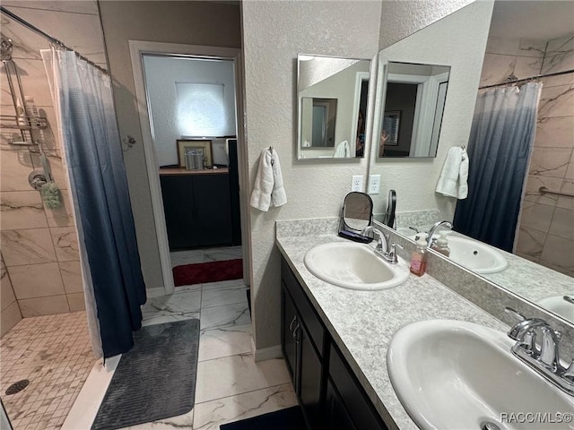 bathroom featuring vanity and a shower with shower curtain