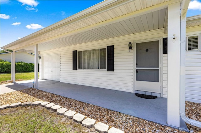 10780 SW 62nd Avenue Rd, Ocala, FL 34476 - entrance to property with a porch, a garage, and driveway