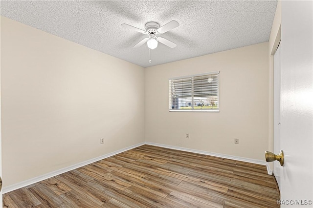 10780 SW 62nd Avenue Rd, Ocala, FL 34476 - empty room featuring ceiling fan, wood finished floors, a textured ceiling, and baseboards