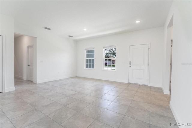 empty room featuring light tile patterned flooring