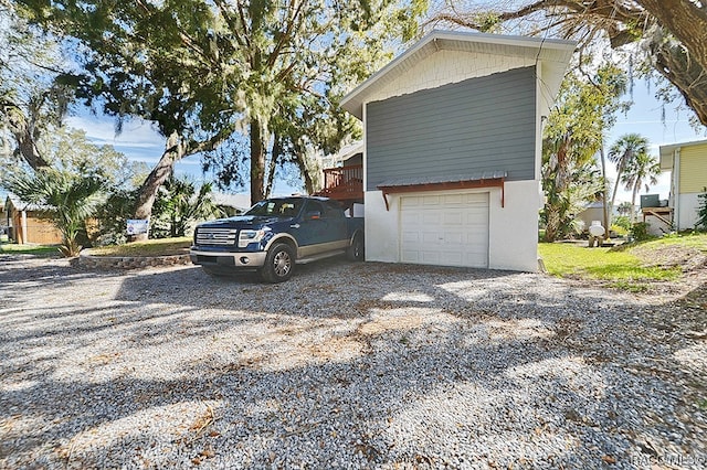 view of side of home featuring a garage