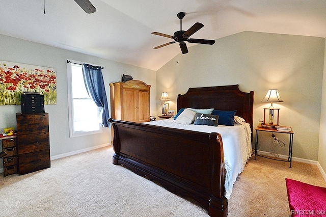 bedroom with ceiling fan, lofted ceiling, and light carpet