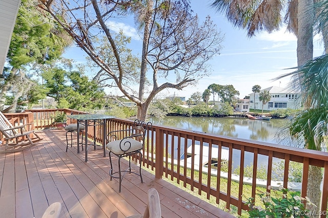 wooden deck featuring a water view