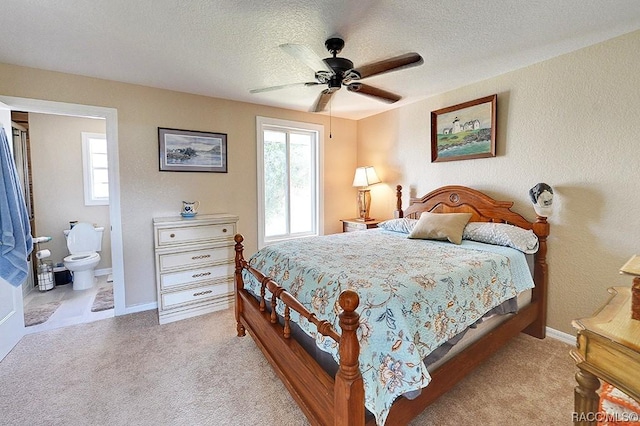 13920 W Evers Ct, Crystal River, FL 34429 - carpeted bedroom featuring a textured ceiling, a ceiling fan, a textured wall, and connected bathroom