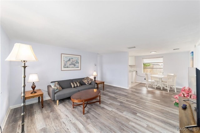 living room with light hardwood / wood-style floors