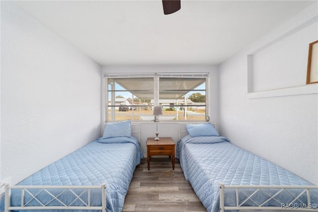 bedroom featuring ceiling fan and hardwood / wood-style flooring