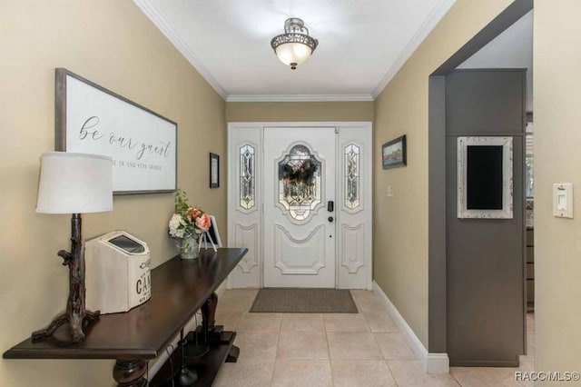 entrance foyer featuring ornamental molding and light tile patterned floors