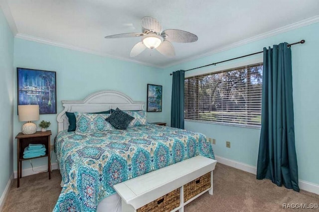 bedroom with ornamental molding, ceiling fan, and carpet flooring