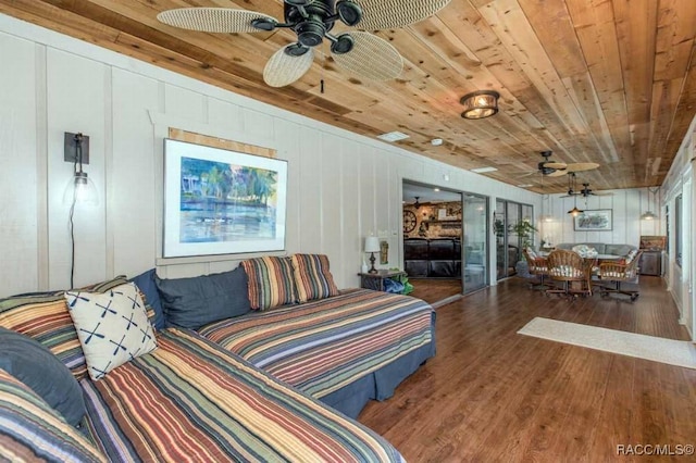 living room featuring hardwood / wood-style floors, wood ceiling, and ceiling fan