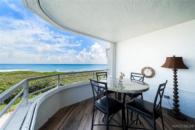 9950 S Ocean Dr Unit 302, Jensen Beach, FL 34957 - balcony featuring view of water and beach and outdoor dining area