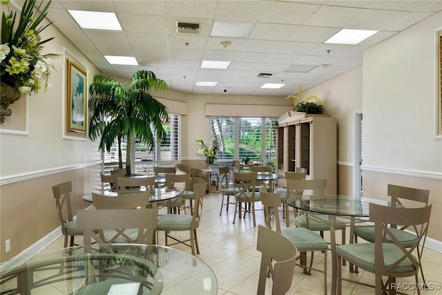 9950 S Ocean Dr Unit 302, Jensen Beach, FL 34957 - dining room with a drop ceiling and light tile patterned floors