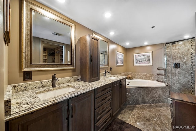 bathroom with walk in shower, a garden tub, a sink, and double vanity