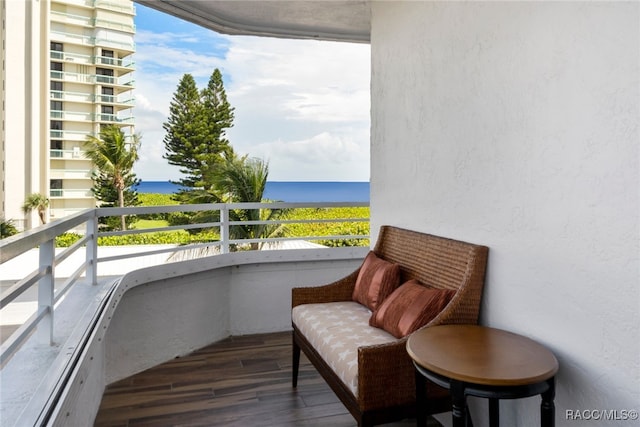 balcony featuring a water view