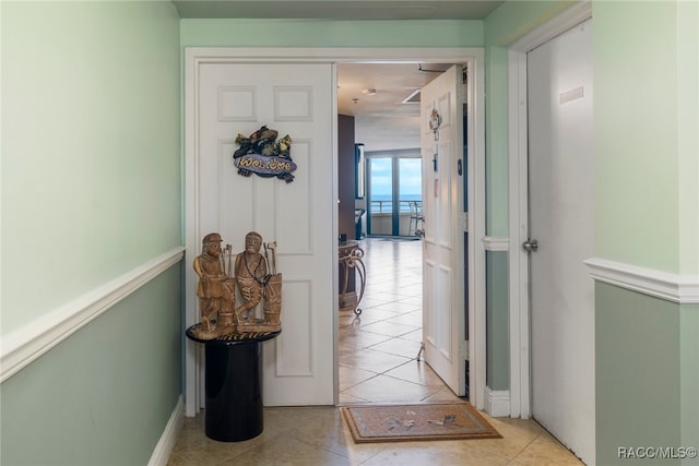 hallway with light tile patterned floors