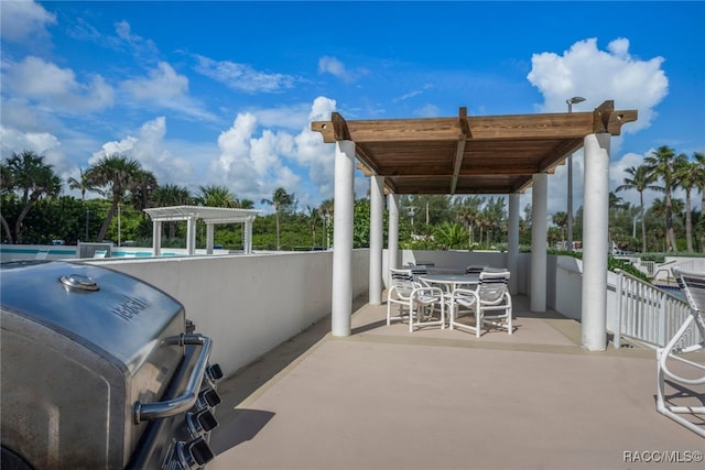 view of patio with outdoor dining area, grilling area, a community pool, and a pergola