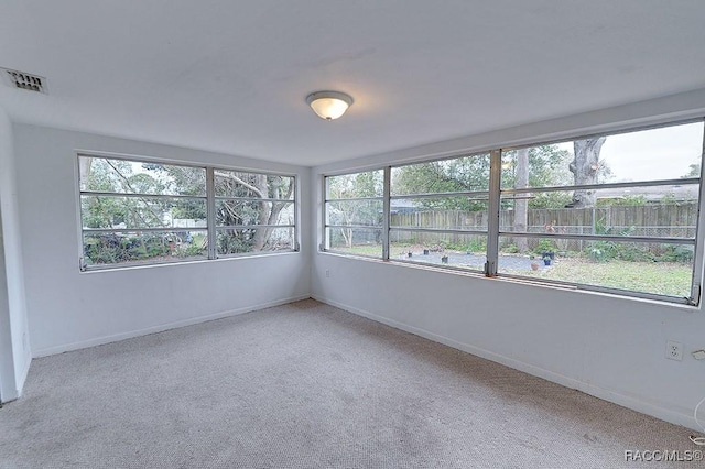 unfurnished sunroom with visible vents