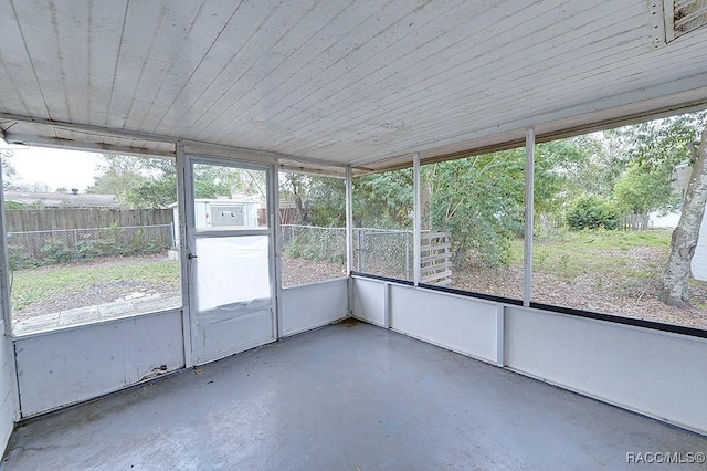 unfurnished sunroom featuring a healthy amount of sunlight