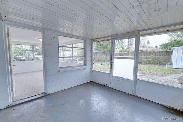 unfurnished sunroom featuring plenty of natural light