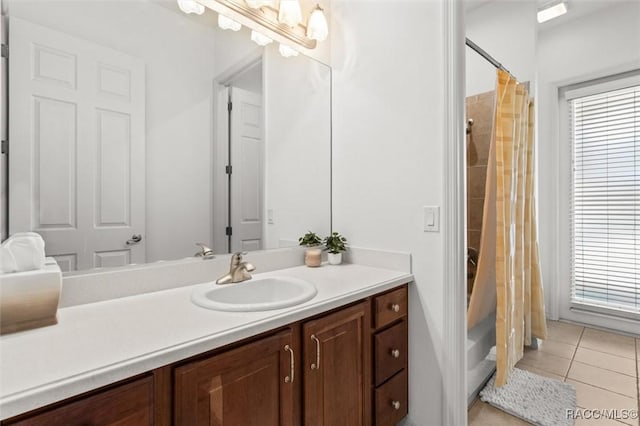 full bath with vanity, a shower with shower curtain, and tile patterned floors