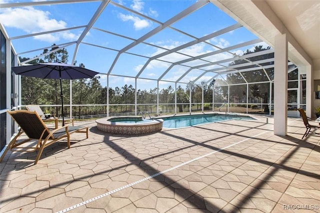 view of swimming pool with a patio area, a pool with connected hot tub, and glass enclosure