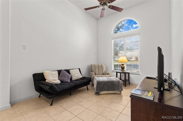 sitting room featuring light tile patterned floors, ceiling fan, and baseboards