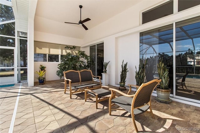 sunroom with a ceiling fan