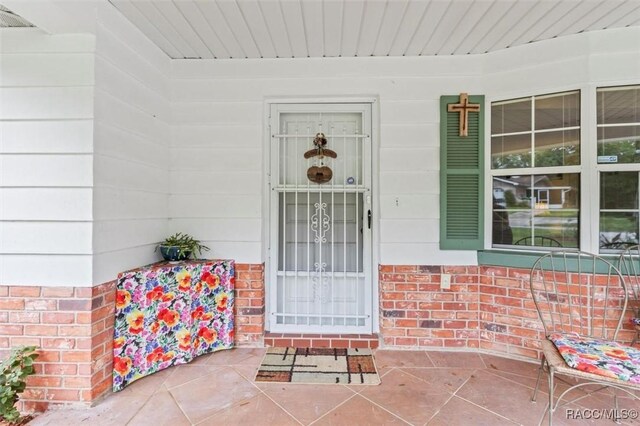 3550 S Dean Ter, Inverness, FL 34452 - property entrance with covered porch and brick siding