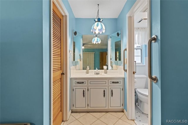 3550 S Dean Ter, Inverness, FL 34452 - bathroom featuring a closet, vanity, tile patterned floors, and ceiling fan