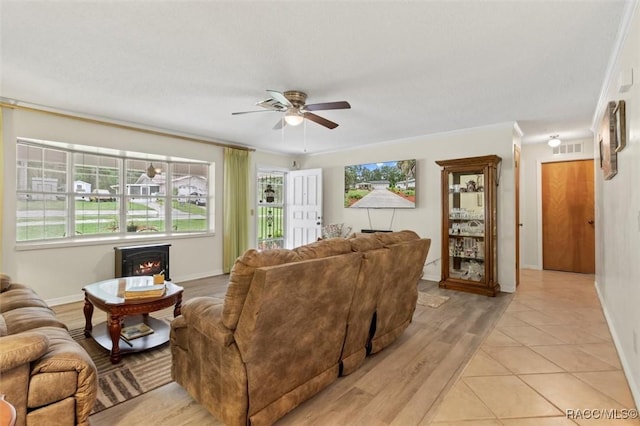 3550 S Dean Ter, Inverness, FL 34452 - living area featuring a ceiling fan and a fireplace