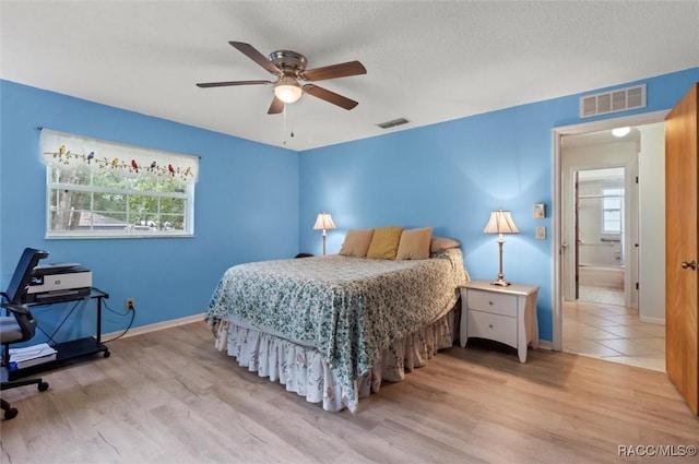 3550 S Dean Ter, Inverness, FL 34452 - bedroom featuring wood finished floors, ceiling fan, and a textured ceiling