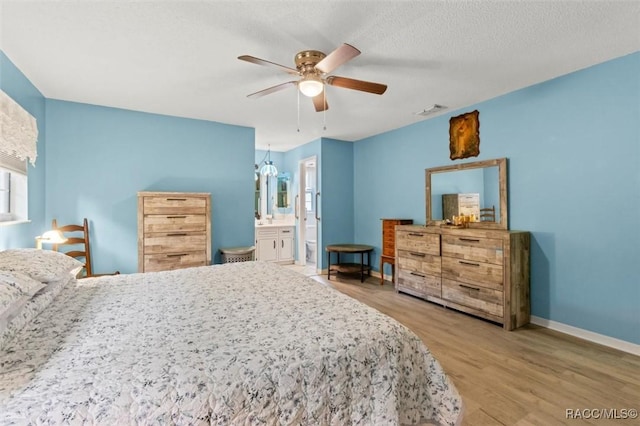 3550 S Dean Ter, Inverness, FL 34452 - bedroom with wood finished floors, a ceiling fan, and connected bathroom