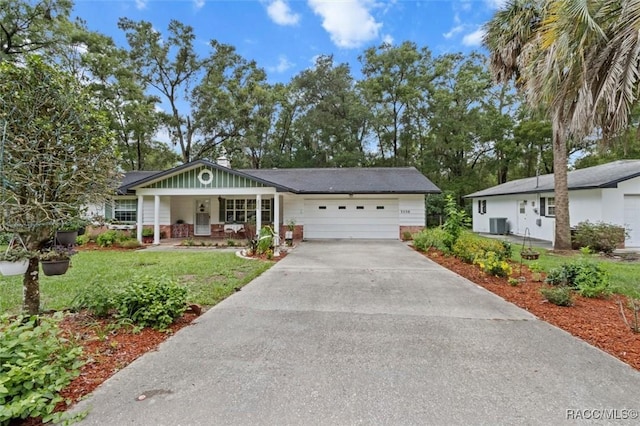 3550 S Dean Ter, Inverness, FL 34452 - ranch-style home featuring covered porch, concrete driveway, a front yard, and a garage