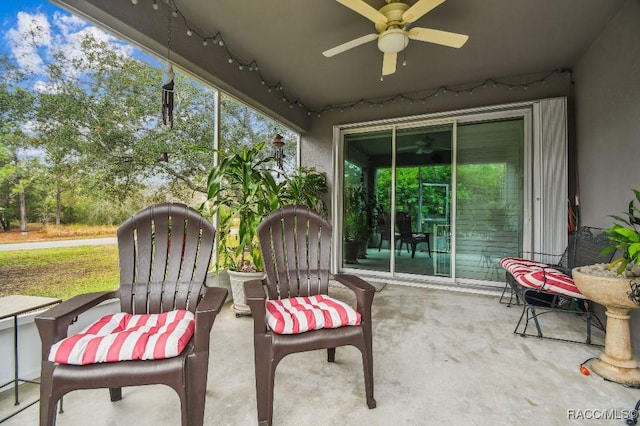 sunroom with a ceiling fan