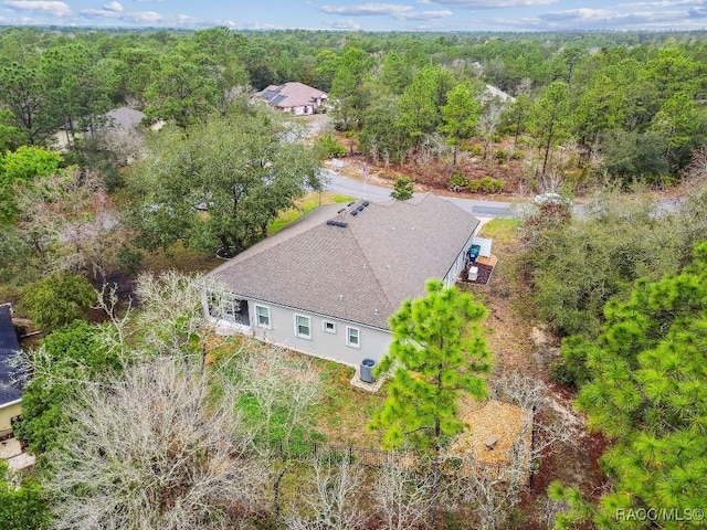 drone / aerial view with a view of trees