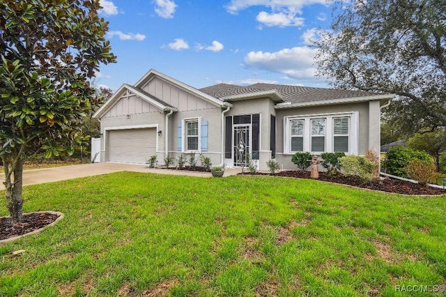 view of front of home with a garage, driveway, board and batten siding, and a front lawn