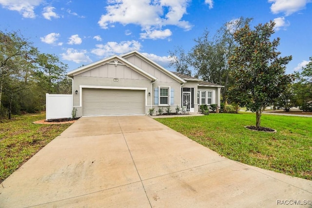 ranch-style home with an attached garage, driveway, board and batten siding, and a front yard