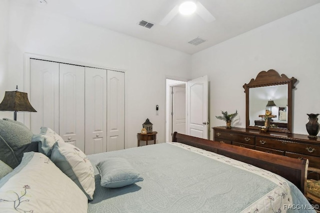 bedroom featuring a ceiling fan, visible vents, and a closet