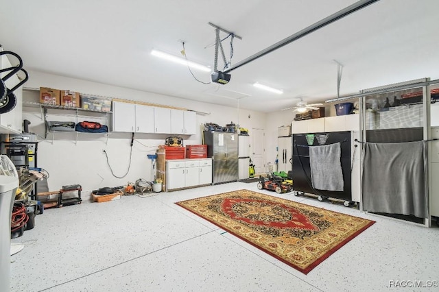 garage featuring ceiling fan and a garage door opener