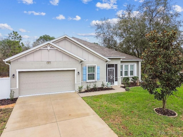 ranch-style home featuring a garage, a shingled roof, concrete driveway, a front lawn, and board and batten siding