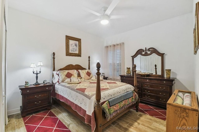 bedroom with a ceiling fan and wood finished floors