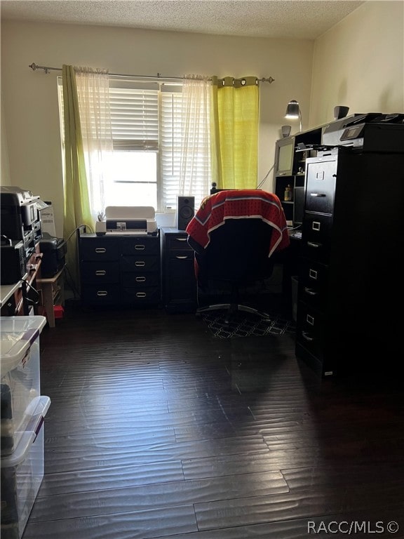 office space with a textured ceiling and dark hardwood / wood-style floors